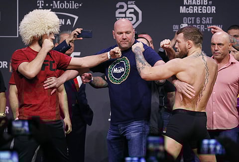 Conor McGregor, right, and Khabib Nurmagomedov face off during a ceremonial weigh-in for the UFC 229 mixed martial arts fight Friday. (Photo | AP)