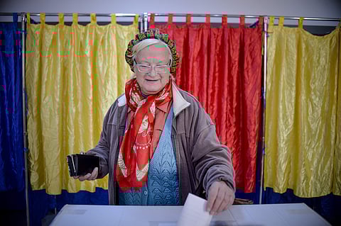 A woman casts her vote, in Bucharest, Romania | AP