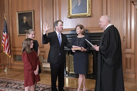 Retired Justice Anthony M Kennedy (R) administers the Judicial Oath to Judge Brett Kavanaugh in the Justices' Conference Room of the Supreme Court Building | AP