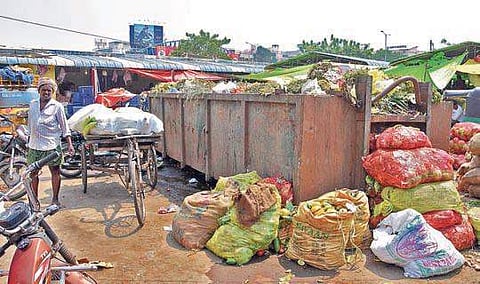 Overflowing garbage bins at a Rythu Bazaar in Vijayawada as sanitation workers continue their indefinite strike on Saturday| R V K Rao