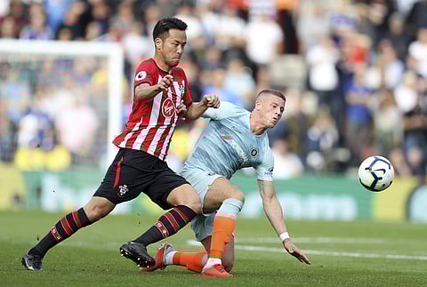 Chelsea's Ross Barkley, right, and Southampton's Maya Yoshida battle for the ball during the English Premier League soccer match at St Mary's Stadium, Southampton, England, Sunday Oct. 7, 2018. | AP