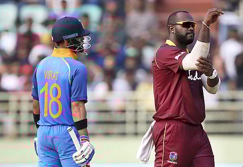 West Indies' Ashley Nurse, right, celebrates the dismissal of India's Ambati Rayudu during the second one-day international cricket match between India and West Indies in Visakhapatnam, India. (Photo | AP)