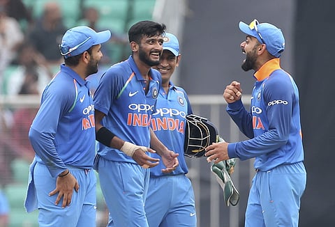 India's captain Virat Kohli, right, shares a laugh with teammates after the dismissal of West Indies' Rovman Powell during the fifth and last one-day international cricket match between India and West Indies in Thiruvananthapuram. (Photo | AP)