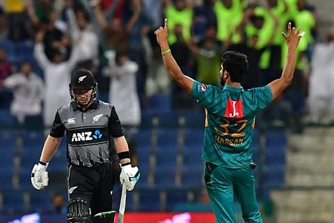 Pakistan' cricketer Hasan Ali (R) celebrates after he dismissed New Zealand's cricketer Tim Seifert (L), during the first T20 cricket match between Pakistan and New Zealand at the Abu Dhabi Cricket Stadium in Abu Dhabi on October 31, 2018. | AFP