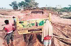 A tractor lifting sand near Badabaragaon | Express
