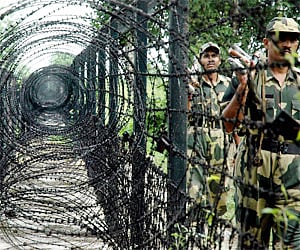 Border Security Force patrol near barbed wire fence at the border of India and Bangladesh near Agartala. (Photo | PTI)