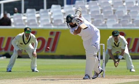 South African bastman Hashim Amla plays a shot from a ball of unseen Australian bowler Ryan Harris during the third day of the first Test between Australia and South Africa at Newlands Stadium in Cape Town on November 11, 2011. (File | AFP)