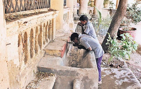 Drinking water facilities are poorly maintained and are filled with dirt at the Government High School in Gunfoundry, in Hyderabad on Monday.