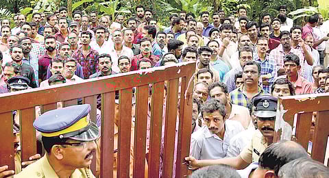 Residents gathered in front of the house of DySP B Harikumar, who committed suicide, at Veilur near Kallambalam in Thiruvananthapuram on Tuesday | B P Deepu