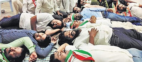 Supporters of DCC chief N Rajender Reddy, who locked themselves in the party office demanding Warangal West ticket to their leader, on Sunday | Express photo