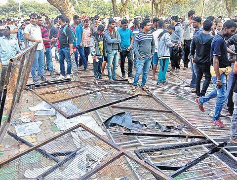 Broken barricades in front of a ticket counter at Kalinga Stadium in Bhubaneswar on Thursday | Express