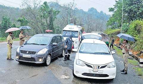 Police personnel checking the vehicles arriving at Nilakkal on Friday (EPS | A Sanesh)