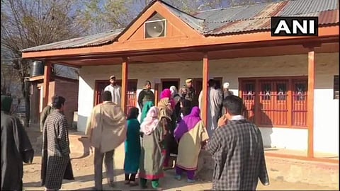 Voters in Uri queue to vote in the first phase of panchayat polls in Jammu & Kashmir.(Photo| ANI)