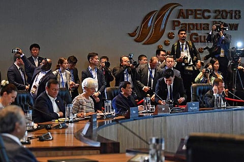 International Monetary Fund (IMF) managing director Christine Lagarde (3rd L) sits next to Philippine President Rodrigo Duterte (C) during a session at the Asia-Pacific Economic Cooperation (APEC) Summit in Port Moresby on November 18, 2018.  (Photo | AFP