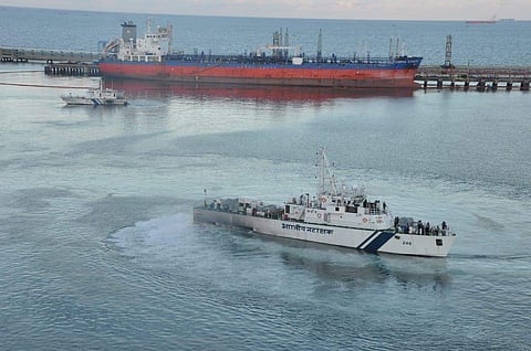 Coast Guard officials inspecting the oil spill  Marine Liquid Terminal on Sunday. (Photo | By special arrangement)
