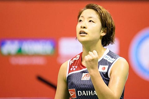 Japan's Nozomi Okuhara celebrates her victory over Thailand's Ratchanok Intanon in their women's singles final at the Hong Kong Open badminton tournament. (Photo | AFP)
