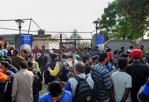 People gather at the Nirankari Bhawan where two men on a motorcycle reportedly threw a grenade during a religious congregation in Adliwal village near Amritsar (Photo | PTI)