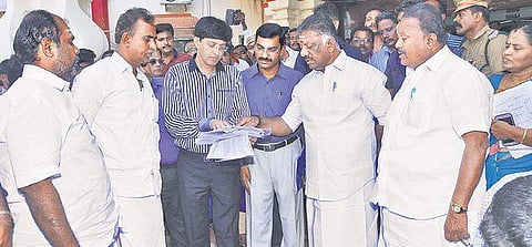 Deputy CM O Panneerselvam enquiring with higher officials at the Nagapattinam Collectorate on Sunday about the rescue, relief and rehabilitation measures being taken in the coastal villages ravaged by the cyclone 'Gaja | Express