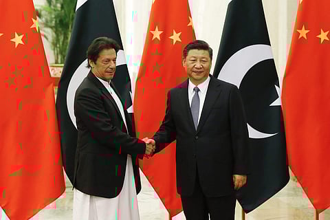 China's President Xi Jinping, right, meets Pakistan's Prime Minister Imran Khan at the Great Hall of the People in Beijing. (Photo | AP)