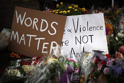 Flowers surround signs on October 31, 2018, part of a makeshift memorial outside the Tree of Life Synagogue to the 11 people killed during worship services (File | AP)