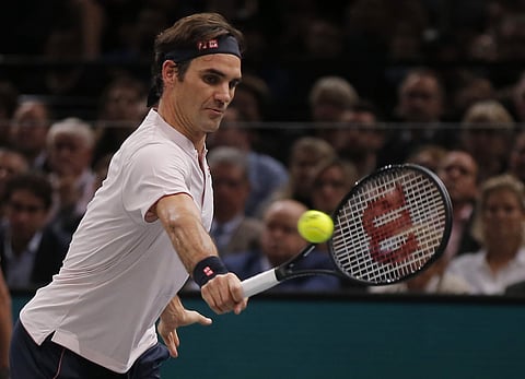 Roger Federer of Switzerland returns the ball to Fabio Fognini of Italy during their third round match of the Paris Masters tennis tournament at the Bercy Arena in Paris, France, Thursday, Nov. 1, 2018.  | AP