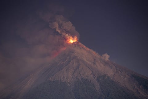The Volcan de Fuego, or Volcano of Fire, spews hot molten lava and ash from its crater in Escuintla, Guatemala, early Monday, Nov. 19, 2018. (Photo | AP)