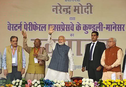 PM Narendra Modi waves to the crowd after the inaugural event in Gurugram | PTI