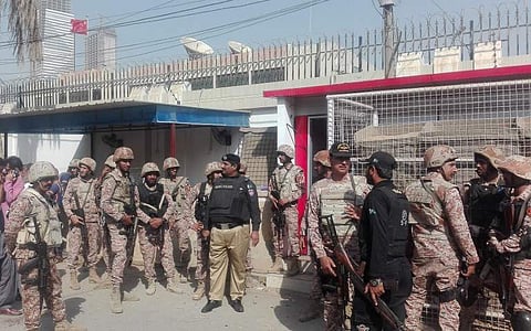 Pakistani security personnel stand outside the Chinese consulate after an attack in Karachi on November 23, 2018. (Photo | AFP)