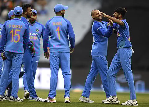 India's Khaleel Ahmed, right, is congratulated by teammates after dismissing Australia's D'Arcy Short during the T20I at Brisbane | AP