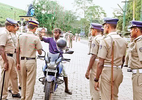 Cops stopping a motorist for inspection at Nilackal in Sabarimala, where security has been beefed up (Photo |EPS)
