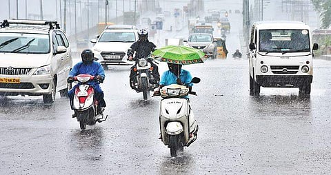 Motorists drive in the rain near Velachery on Thursday  |  ASHWIN PRASATH