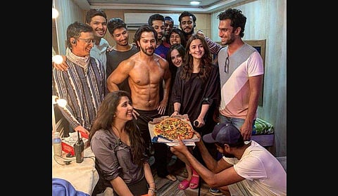Alia Bhatt and Varun Dhawan on Friday celebrated the end of the 'crazy' schedule for their upcoming period drama titled 'Kalank' with a pizza party along with the crew of the film. (Photo | Twitter)