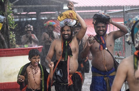 A happy child with his father in Sannidhanam during his Sabarimala pilgrimage (Photo | EPS/Melton Antony)