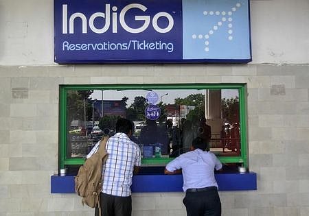 Passengers stand at the ticket counter of Indigo Airlines at the airport on the outskirts of Agartala ( File photo| Reuters )