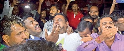 Grief-striken fans mourn the death of Ambareesh outside Vikram Hospital on Saturday night | PANDARINATH B