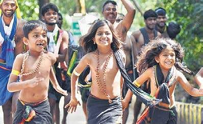 Child devotees in a playful mood at Marakkoottam on the trekking path after darshan of Lord Ayyappa at the Sabarimala temple on Saturday. The number of pilgrims is slowly but steadily rising | B P Deepu