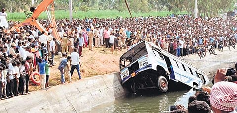 A recent picture of the bus being lifted out of the canal at Mandya