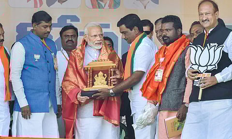 Prime Minister Narendra Modi is felicitated by his party workers and leaders during an election rally ahead of the Telangana Assembly Elections at Nizamabad. (Photo| PTI)