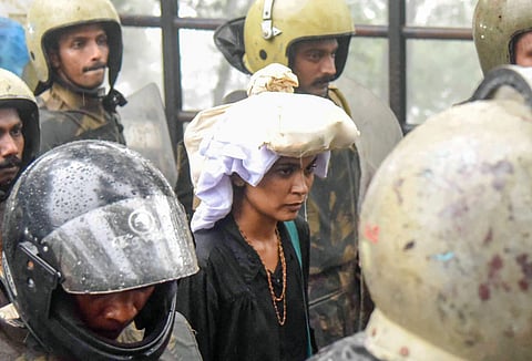 Activist Rehana Fathima being excorted by Kerala police to Sabarimala Temple. (File photo | PTI)