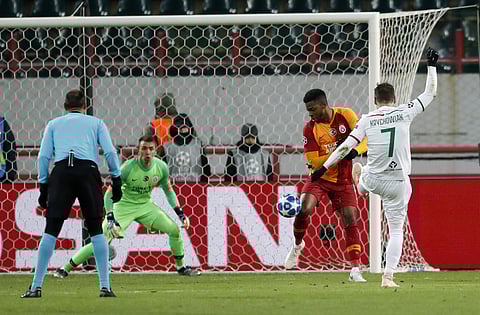 Lokomotiv's Grzegorz Krychowiak (R) scores his side's second goal against Galatasaray goalkeeper Fernando Muslera during a Group D Champions League clash | AP