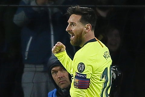 Barcelona captain Lionel Messi celebrates scoring his side's first goal during a Group B Champions League soccer match against PSV Eindhoven  | AP