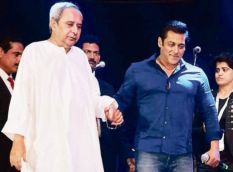 Bollywood superstar Salman Khan ushers CM Naveen Patnaik to the stage at Barabati Stadium in Cuttack on Wednesday | Express
