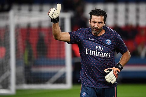 PSG's Italian goalkeeper Gianluigi Buffon salutes supporters during warm up. (Photo | AFP)