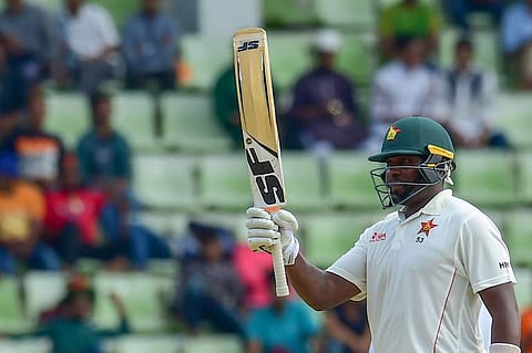 Zimbabwe cricket captain Hamilton Masakadza celebrates fifty runs during the first day of the first Test cricket match against Bangladesh in Sylhet | AFP