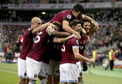 West Ham United's Felipe Anderson (R) celebrates scoring his side's third goal of the game during the English Premier League match against Burnley | AP