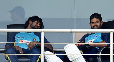 (From left) Nuwan Pradeep and Lahiru Thirimanne (File| AFP)