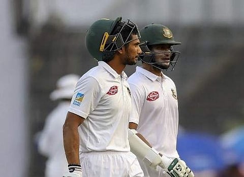 Mahmudullah Riyad and Shakib Al Hasan walk off the field after ending the first day of the 2nd Test.