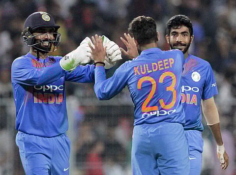 Kuldeep Yadav (C) celebrates with teammates the dismissal of West Indies' Darren Bravo during the first T20 match in Kolkata. | AP