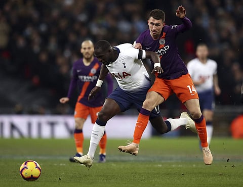 Tottenham Hotspur's Moussa Sissoko, left, and Manchester City's Aymeric Laporte in action during their English Premier League soccer match at Wembley Stadium in London, Monday Oct. 29, 2018. | AP