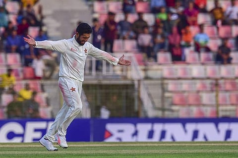 Zimbabwe's cricketer Sikandar Raza celebrates after the dismissal of the Bangladesh cricketer Taizul Islam during the second day of the first Test cricket match between Bangladesh and Zimbabwe in Sylhet on November 4, 2018.  (PHOTO | AFP)